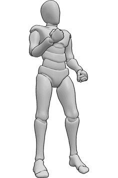 Referencia de poses- Hombre enfadado de pie - Hombre enfadado está de pie con los puños cerrados, mirando hacia delante y mostrando su puño derecho
