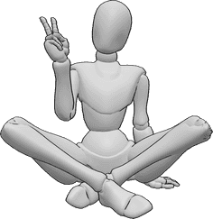 Referencia de poses- Bonita postura con las piernas cruzadas - Mujer sentada en el suelo con las piernas cruzadas haciendo el signo de la paz con la mano derecha.